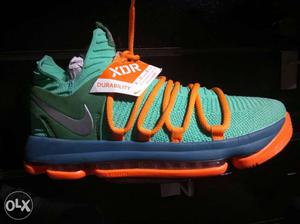 Green, Orange, And Blue Nike Basketball Shoe