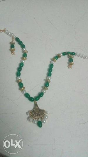 Green, Silver, And Brown Pendant Necklace