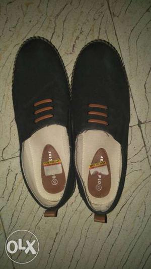 Pair Of Black Suede Slip-on Shoes
