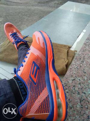 Pair Of Orange-and-blue Low Top Shoes