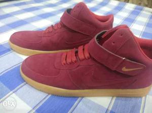 Pair Of Red Nike Velcro Strap High-top Sneakers