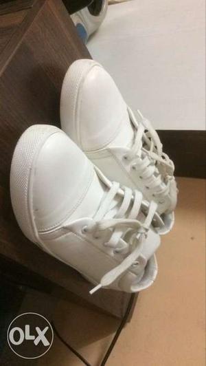 Pair Of White Leather Sneakers