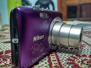 Purple And Gray Nikon Point-and-shoot Camera