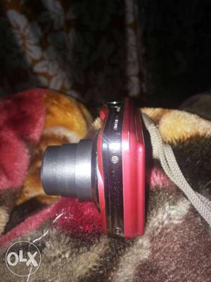 Red And Gray Point-and-shoot Camera