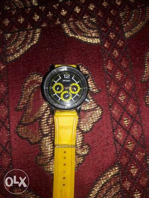 Round Black Chronograph Watch With Yellow Strap