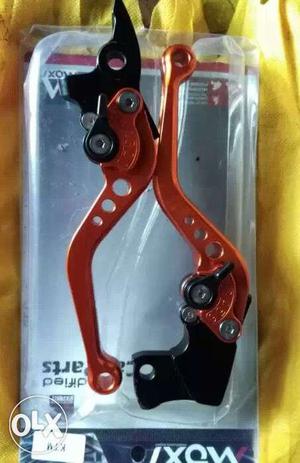 Two Orange-and-black Hand Brake Levers With Box KTM200