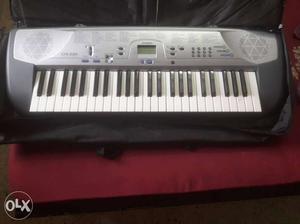 Black And Grey Electric Piano Keyboard With Case