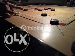 Carrom board with coins 