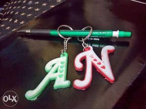 Green And Pink Text Keychains