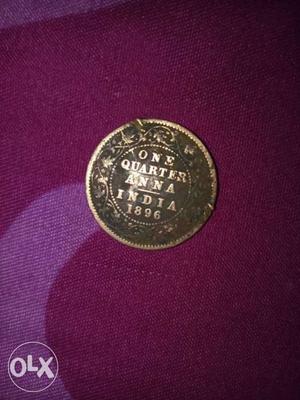 Round Copper-colored One Quarter Anna India Coin