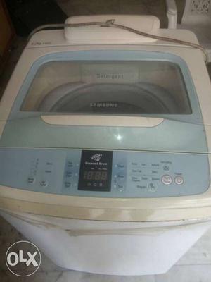 White And Teal Samsung Top-load Clothes Washer