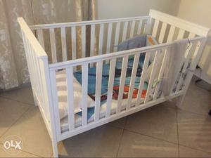 Baby's White Wooden Crib