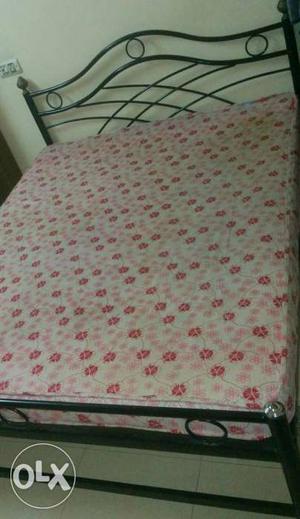Queen size wrought iron cot with mattress. very