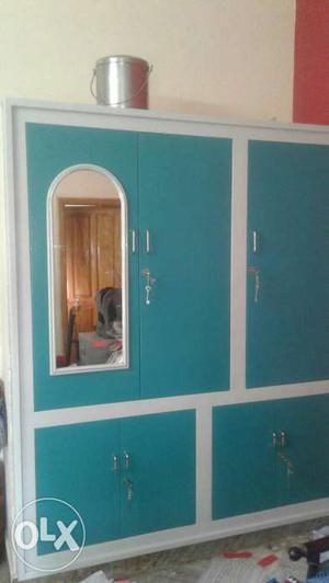 White And Teal Wooden Armoire With Mirror