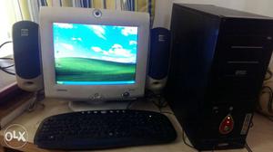 Beige CRT Computer Monitor; Black Computer Keyboard; Mouse;