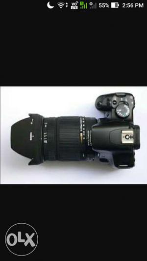 Black DSLR Camera With Telephoto Lens Screenshot