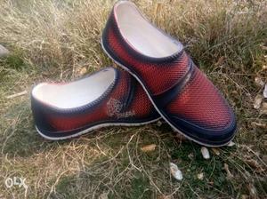 Pair Of Red And Black Slide-on Shoes
