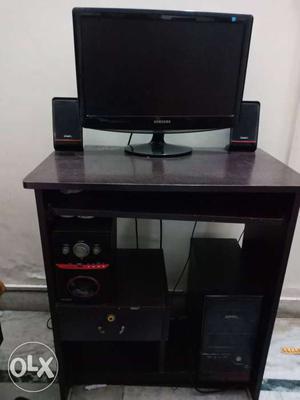 Black Flat Screen TV With Black Wooden TV Stand