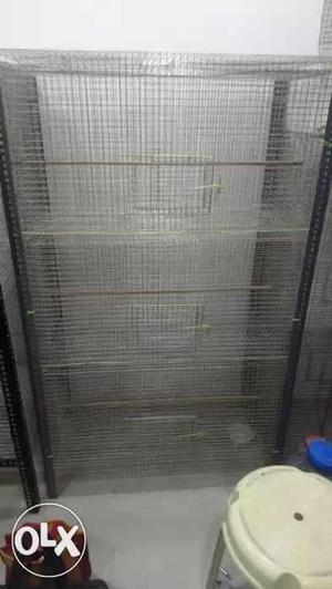 Double layer cages for costly birds