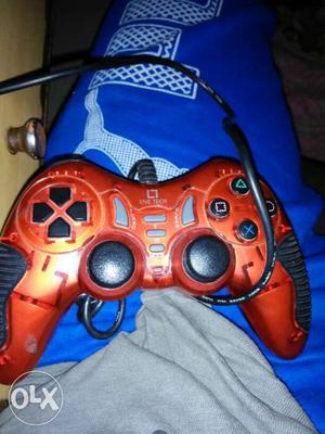 Red And Black Corded Game Controller