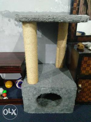 Warm cat house,with cat scratch pillers.
