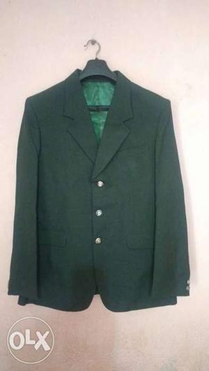 Dark green blazer for sale. Medium size not even