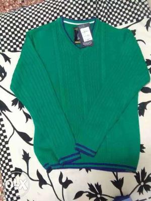 Green V-neck sweater