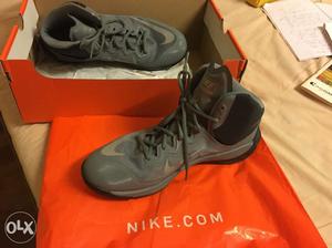 Pair Of Gray Nike Basketball Shoes With Box