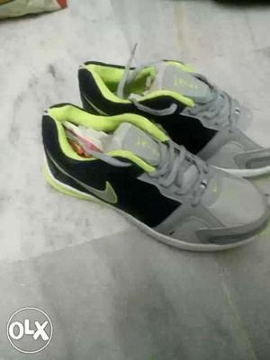 Pair Of Gray-black-and-green Nike Running Shoes