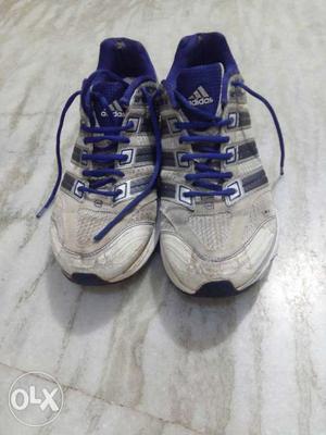 Pair Of White-and-blue Adidas Athletic Shoes