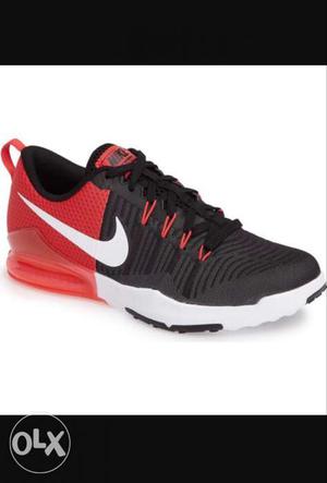 Paired Black And Red Nike Running Shoe