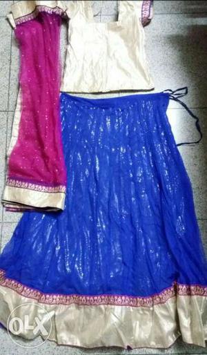 Women's lehenga: dark blue skirt, gold top and pink shawl