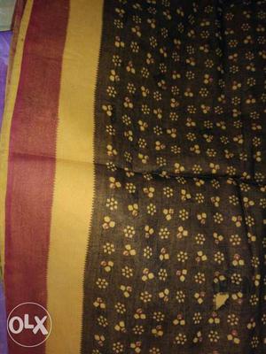 Brown, Yellow, And Red Floral Textile