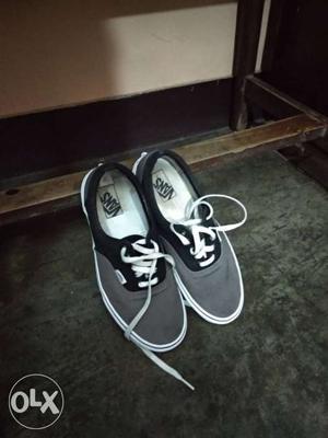 Pair Of Black-and-gray Vans Off The Wall Plimsolls