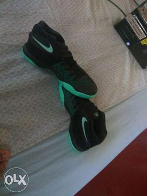 Pair Of Green-and-black Nike Basketball Shoes