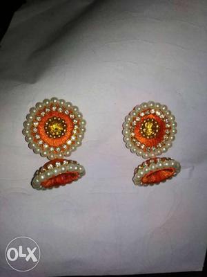 Pair Of Orange Silk Thread Jhumkas With Pearl Beads