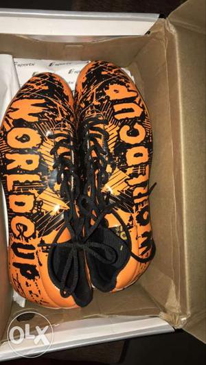 Pair Of Orange-and-black World Cup Cleats With Box