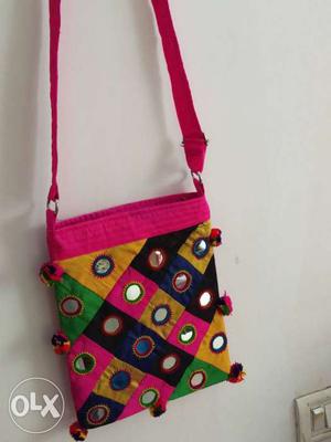 Pink, Blue, And Yellow Sling Bag