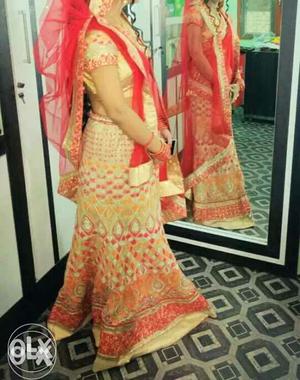 Red and golden bridal lehnga available at very cheap price.