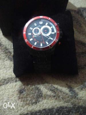 Round Black And Red Chronograph Watch With Black Strap