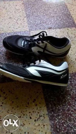 Spike Pair Of Black-and-white Athletic Shoes