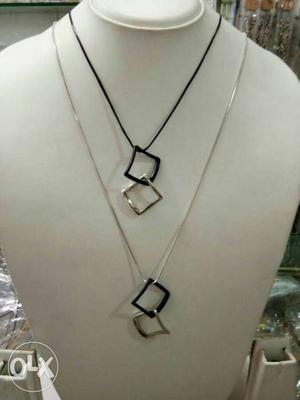 Two Black And Grey Pendant Necklaces