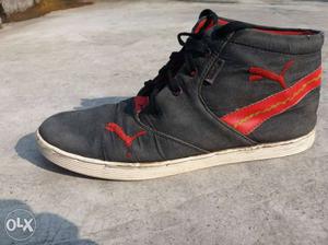 Unpaired Black, White, And Red Puma High-top Sneaker