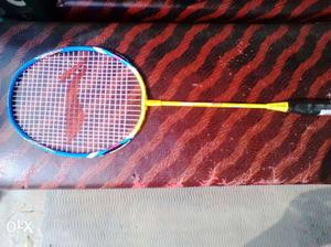 Black, Yellow, And Blue Tennis Racket