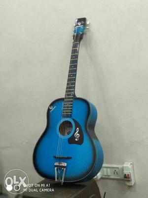 Blue and black acoustic guitar, amazing looks