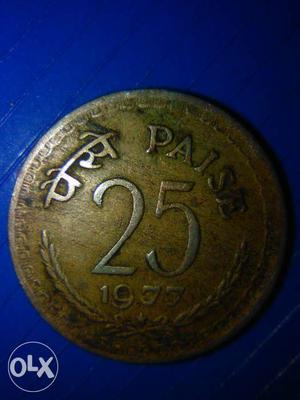  Gold-colored 25 Indian Paise Coin