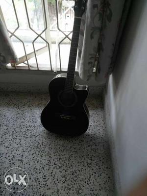 Havana acoustic guitar black colour the strings