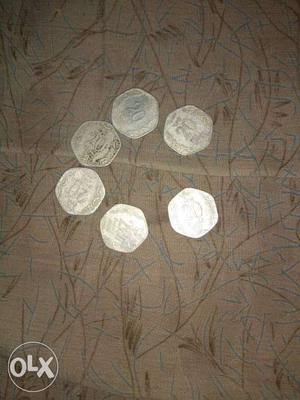 Six 20 paise coins of years s and six for