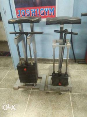 Two Black-and-gray Gym Equipments