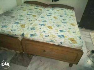 Brown Wooden Bed Frames With White-yellow-and-blue Floral